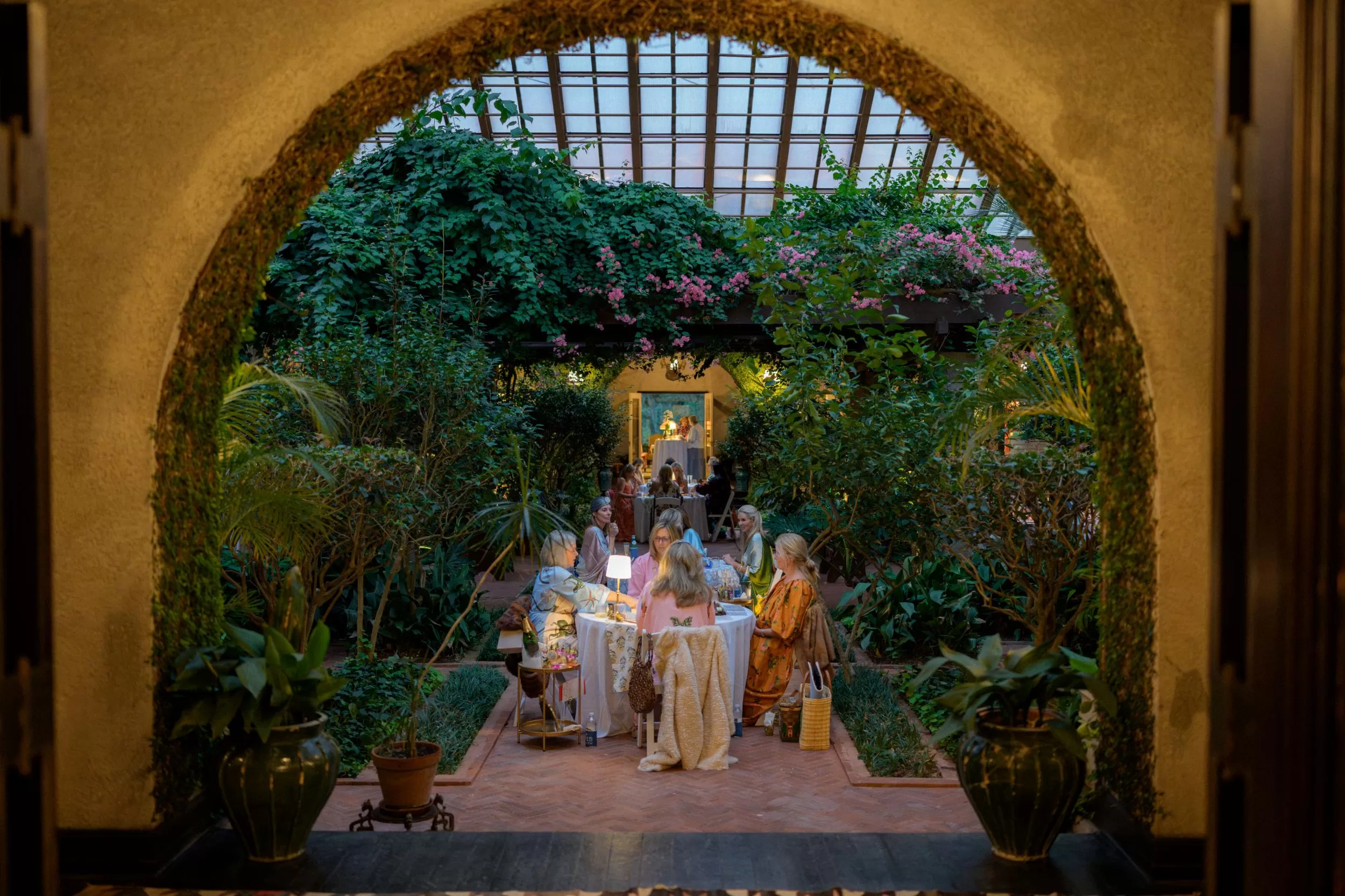 evening outdoor view of women at a table playing mahjon